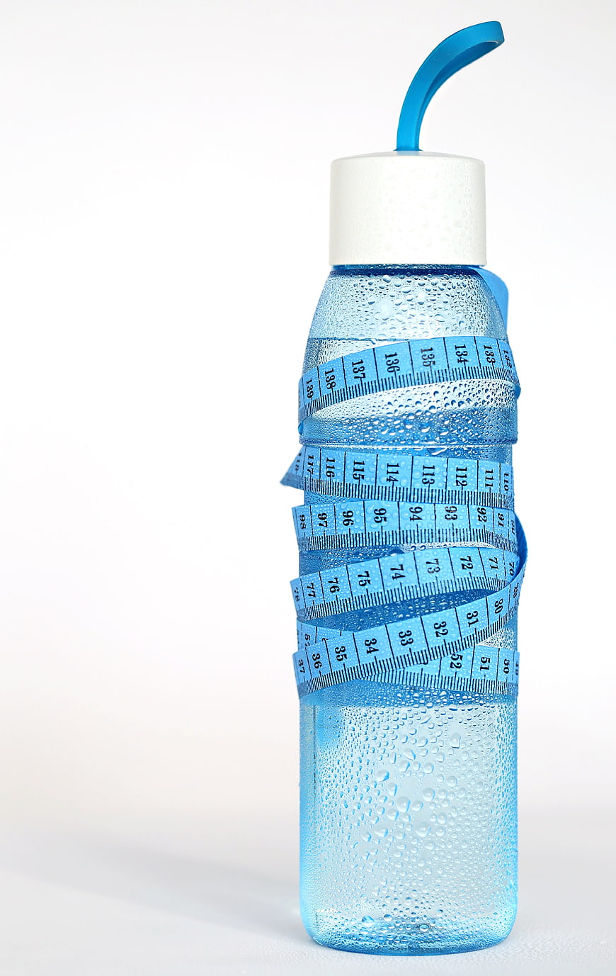 Blue Water Bottle Wrapped In Measuring Tape With Condensation
