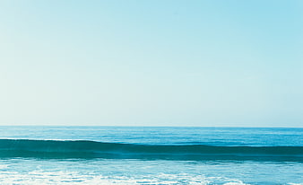 Minimalist Blue Ocean Wave with Large Sky Copyspace
