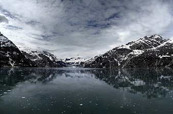 Serene Alpine Lake with Snowy Mountain Reflections