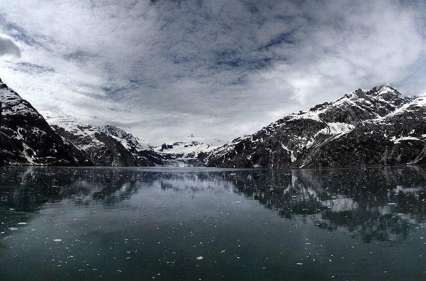 Serene Alpine Lake with Snowy Mountain Reflections