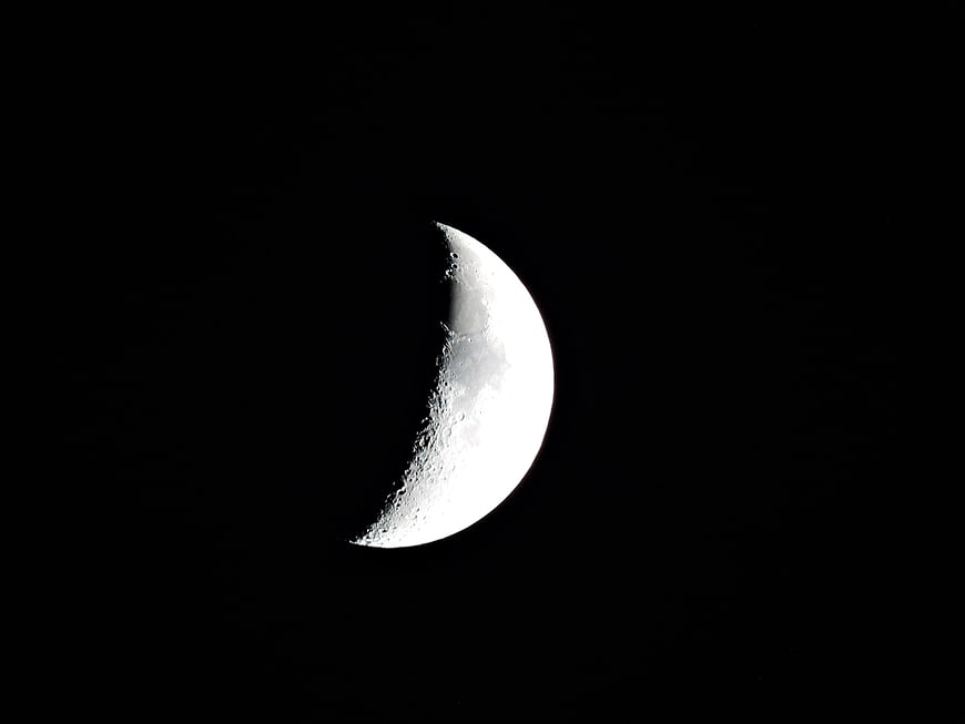 Crescent Moon Against Black Sky