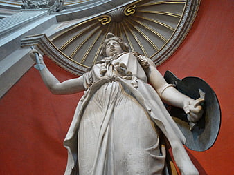 Low angle view of classical marble statue in ornate interior