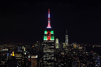 Empire State Building Lit in Red, White, and Green at Night