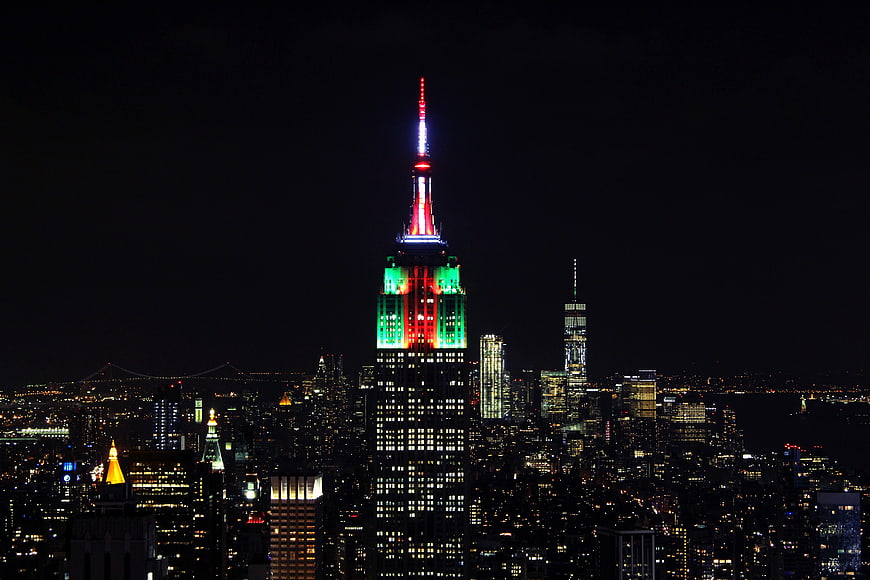 Empire State Building Lit in Red, White, and Green at Night