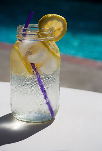 Refreshing Lemonade in Mason Jar by Poolside