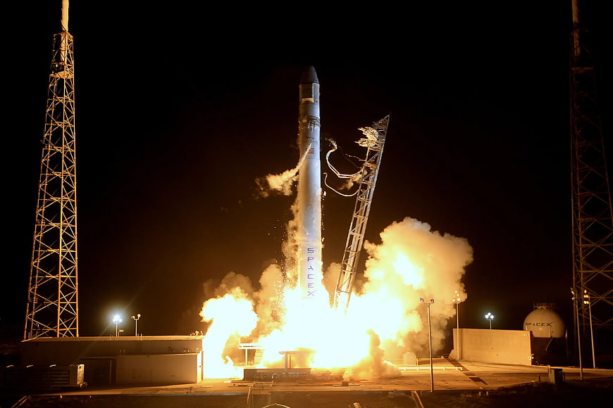 SpaceX Falcon 9 rocket night launch liftoff
