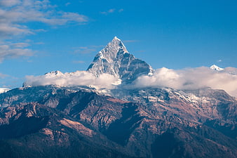 Majestic Snow-Capped Mountain Peak with Clouds