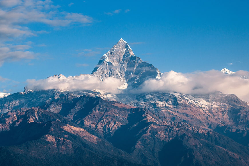 Majestic Snow-Capped Mountain Peak with Clouds