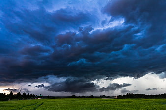 Dramatic Thunderstorm Sky Over Green Agricultural Field