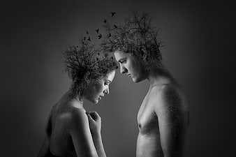 Black and white conceptual art of couple with tree branches and birds