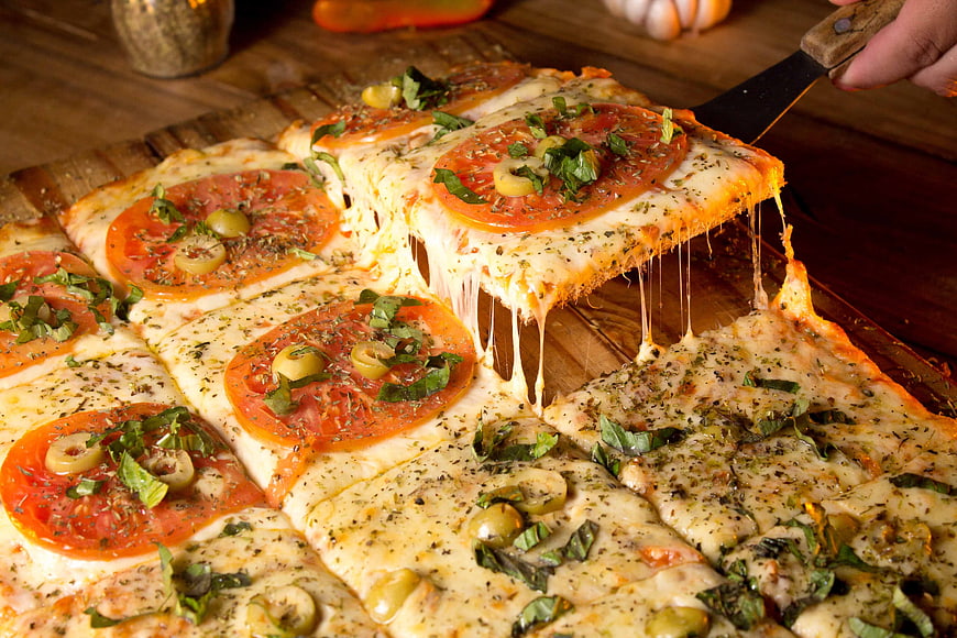 Freshly Baked Flatbread Pizza With Melted Cheese And Toppings