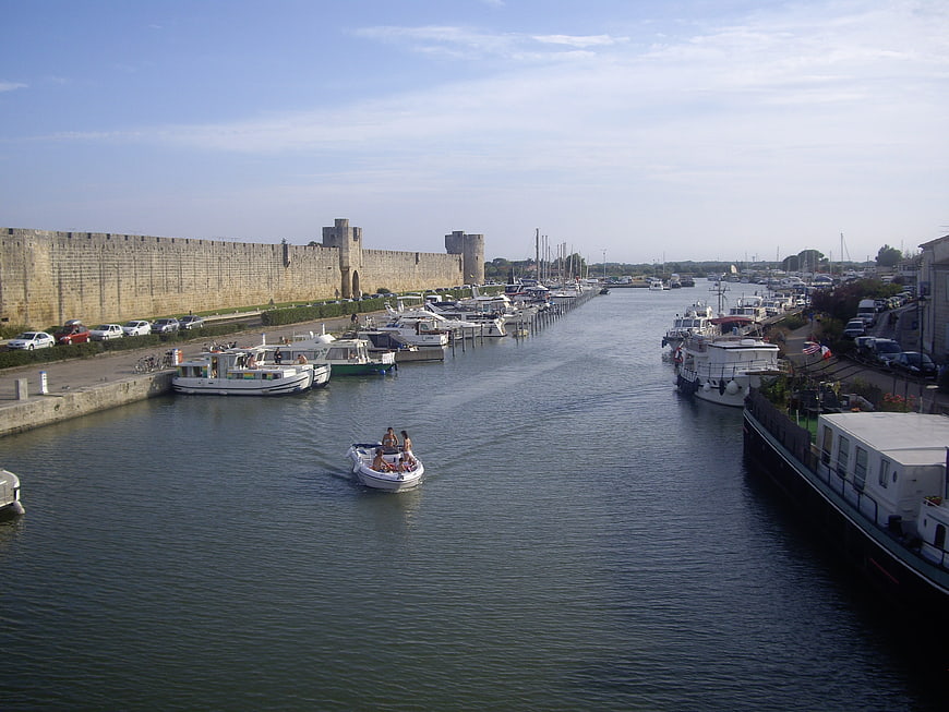 Boat ride in harbor with historic stone fortifications