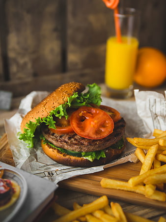 Delicious American style burger with fries and orange juice