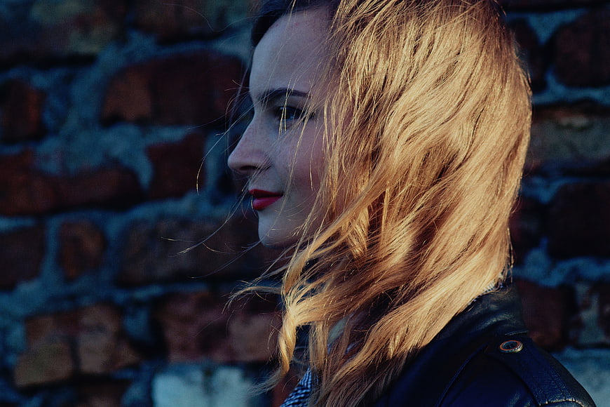Profile of Blonde Woman with Red Lips in Sunlight