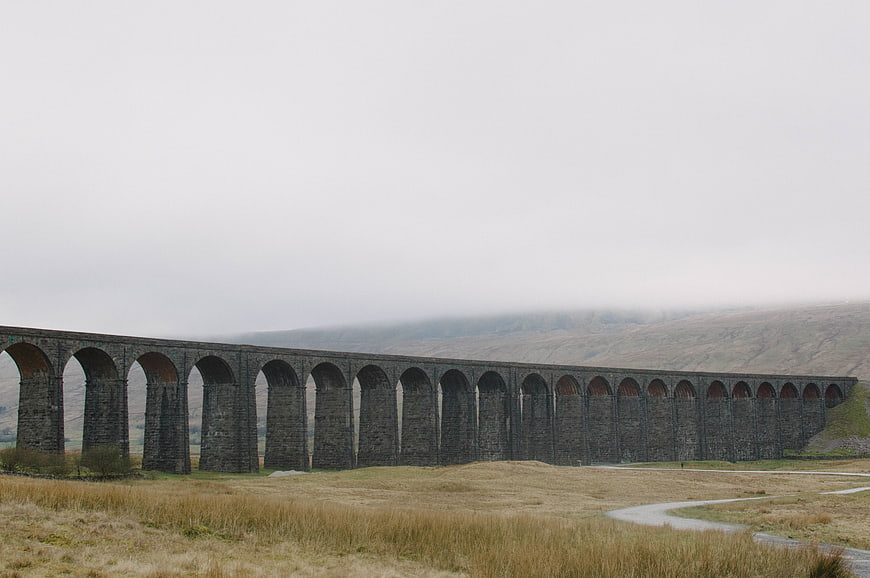 Glenfinnan Viaduct in Scotland with Foggy Hills