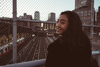 Smiling Asian Woman Portrait on Urban Bridge at Dusk