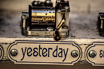 Close-up of vintage music box with yesterday label