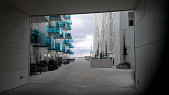 Modern Architecture with Blue Glass Balconies and Concrete Walkway