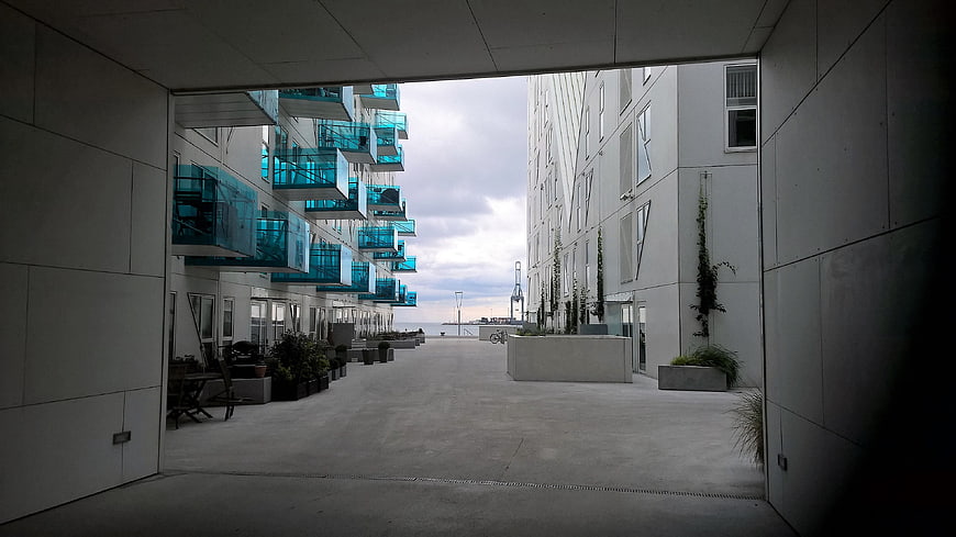 Modern Architecture with Blue Glass Balconies and Concrete Walkway