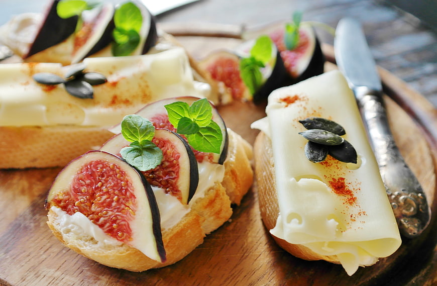 Gourmet Fig and Cheese Crostini on Wooden Board