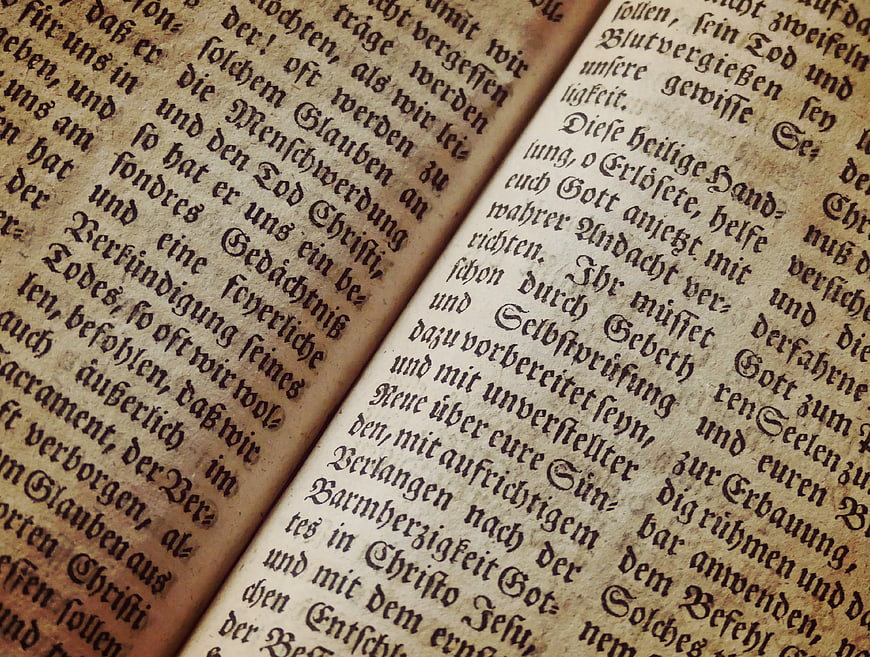 Close-up of antique German text on aged book pages