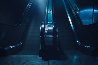 Cinematic Blue Escalator in Empty Underground Station