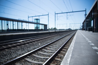 Blurred Train Tracks at Empty Railway Station Platform