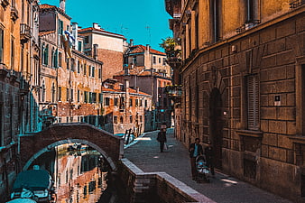 Venetian Canal Scene with Arched Bridge and Walking Pedestrians