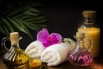 Luxury Spa Still Life With Orchid, Towels, Oils, And Candle