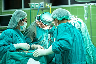 Medical team performing surgery in operating room