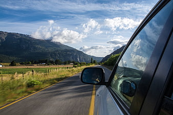 Scenic mountain road trip view from car window