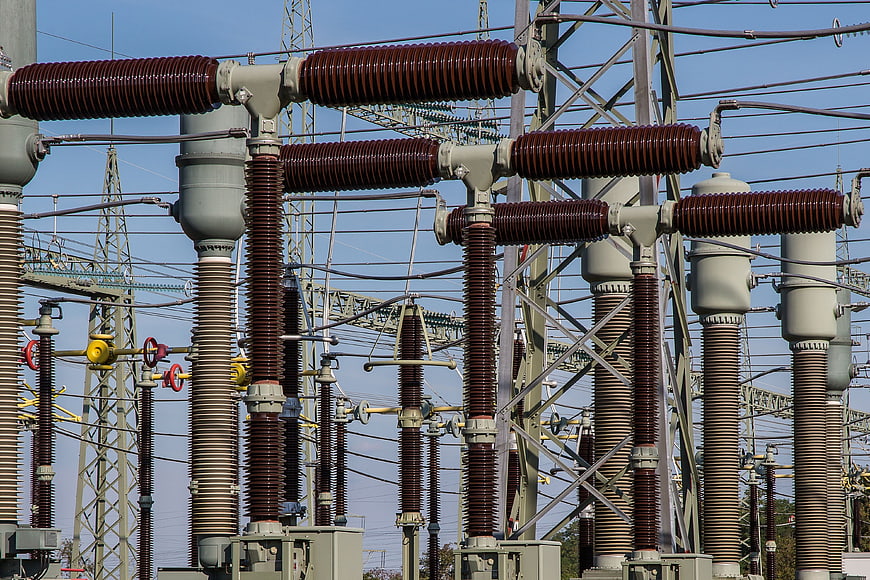 High Voltage Electrical Substation with Insulators and Power Lines
