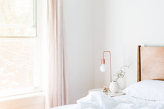 Minimalist Bedroom Interior with White Bed and Copper Lamp