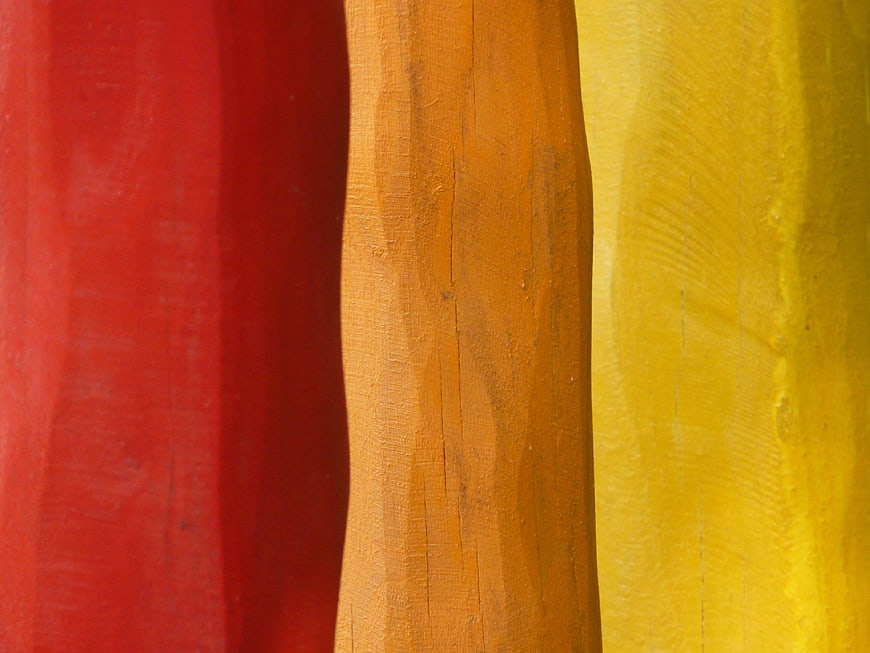 Abstract Vertical Stripes of Red, Orange, and Yellow Painted Wood