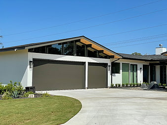 Modern White House with Garage and Driveway