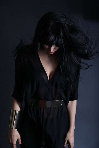 Fashion Portrait of Woman in Black with Metallic Accessories