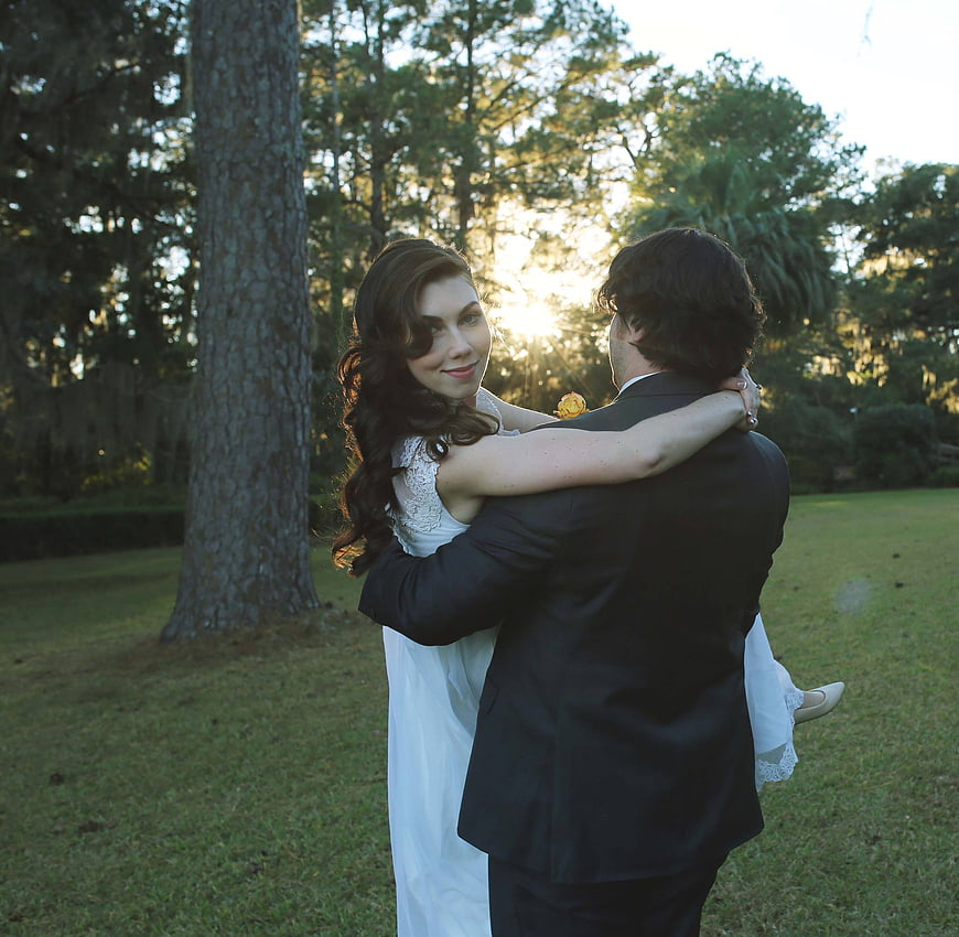 Bride and Groom Hugging in Sunset Backlight