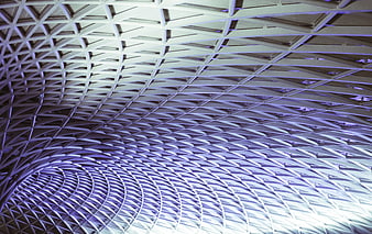 Abstract geometric ceiling pattern with purple lighting