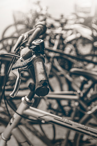 Close-up of vintage bicycle handlebars in black and white