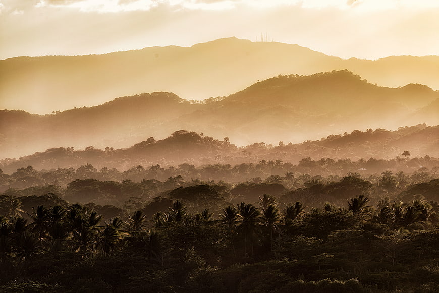 Golden Sunrise Over Tropical Mountain Forest Layers