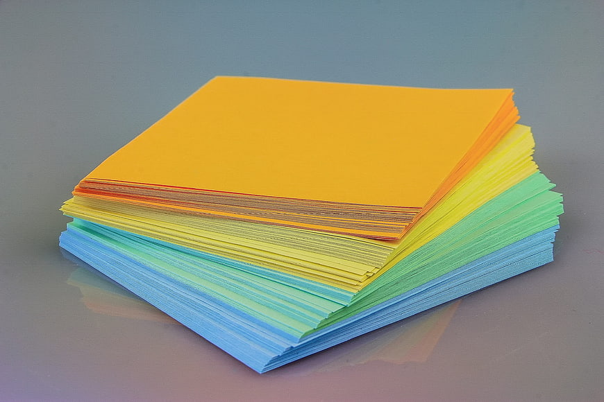 Stack of colorful sticky notes on a gray background