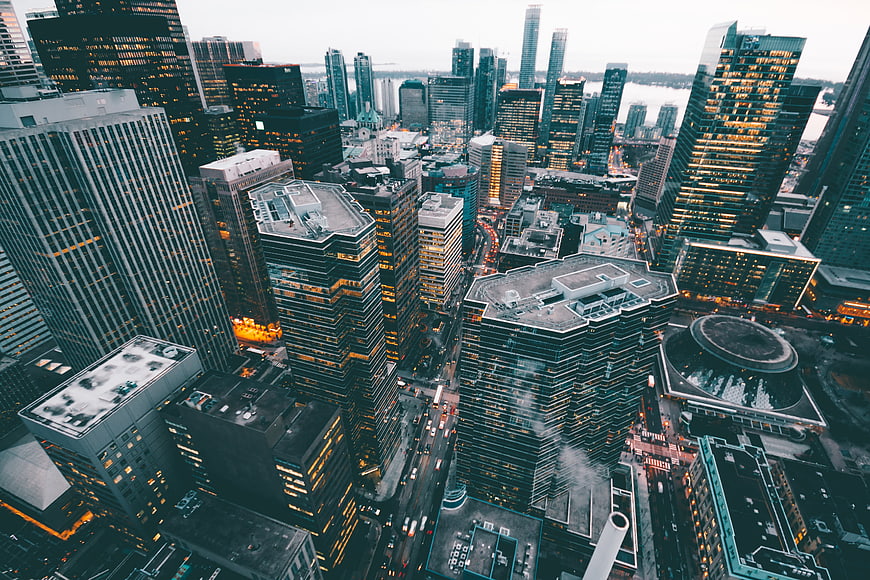Aerial View of Downtown Cityscape at Dusk with Illuminated Skyscrapers