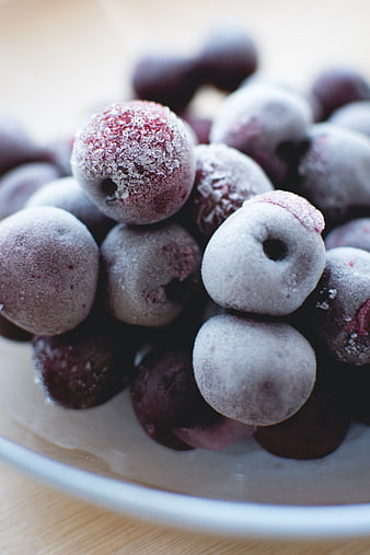 Close-up of Frozen Cherries in a White Bowl
