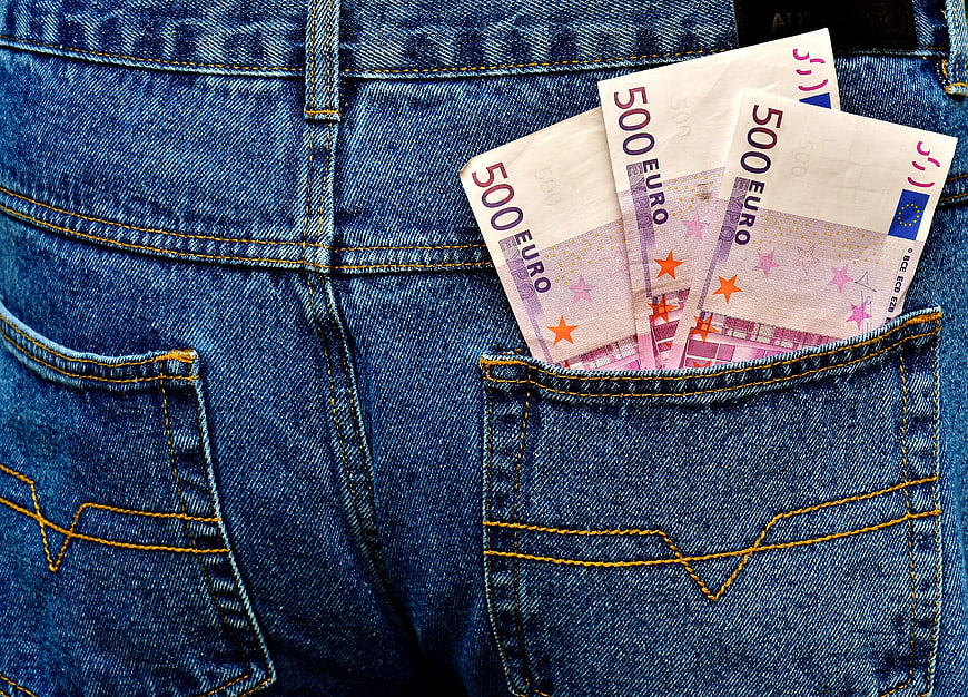 500 Euro banknotes in blue jeans back pocket