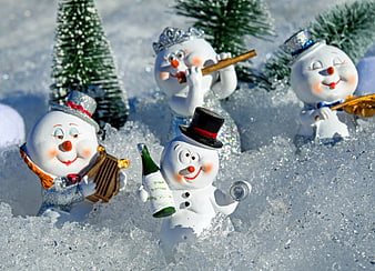Cute Snowman Figurines Celebrating with Wine and Music in Snow