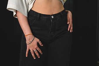 Woman Wearing Black Jeans and Silver Jewelry