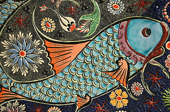 Colorful ceramic fish tile with floral mosaic pattern