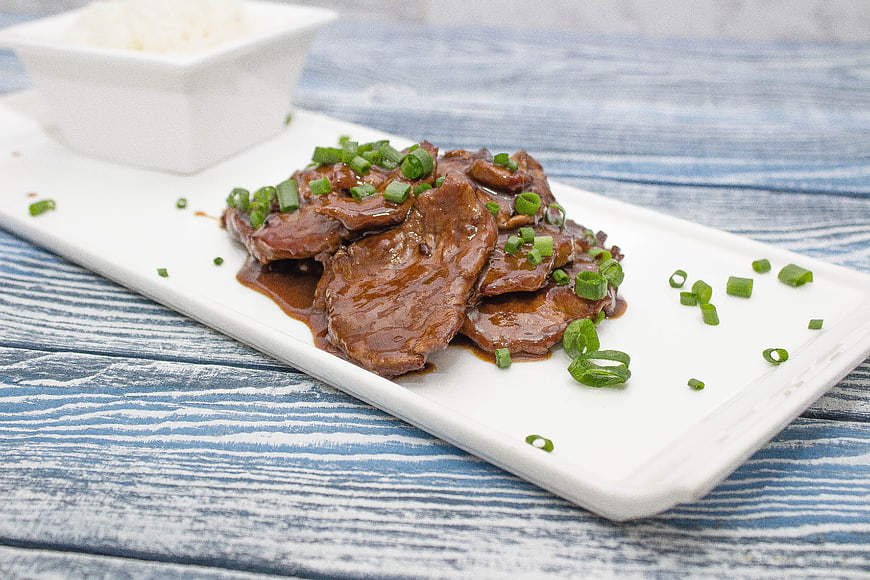 Mongolian Beef with Green Onions on White Plate