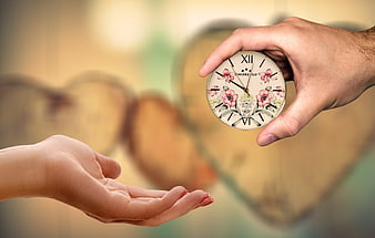 Hand Giving Floral Clock to Open Palm