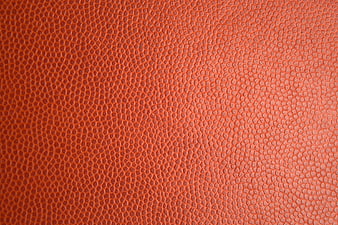 Close-up of textured red leather surface with pebbled grain pattern